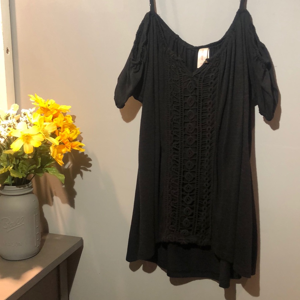 Off the shoulder shirt with tank top straps.